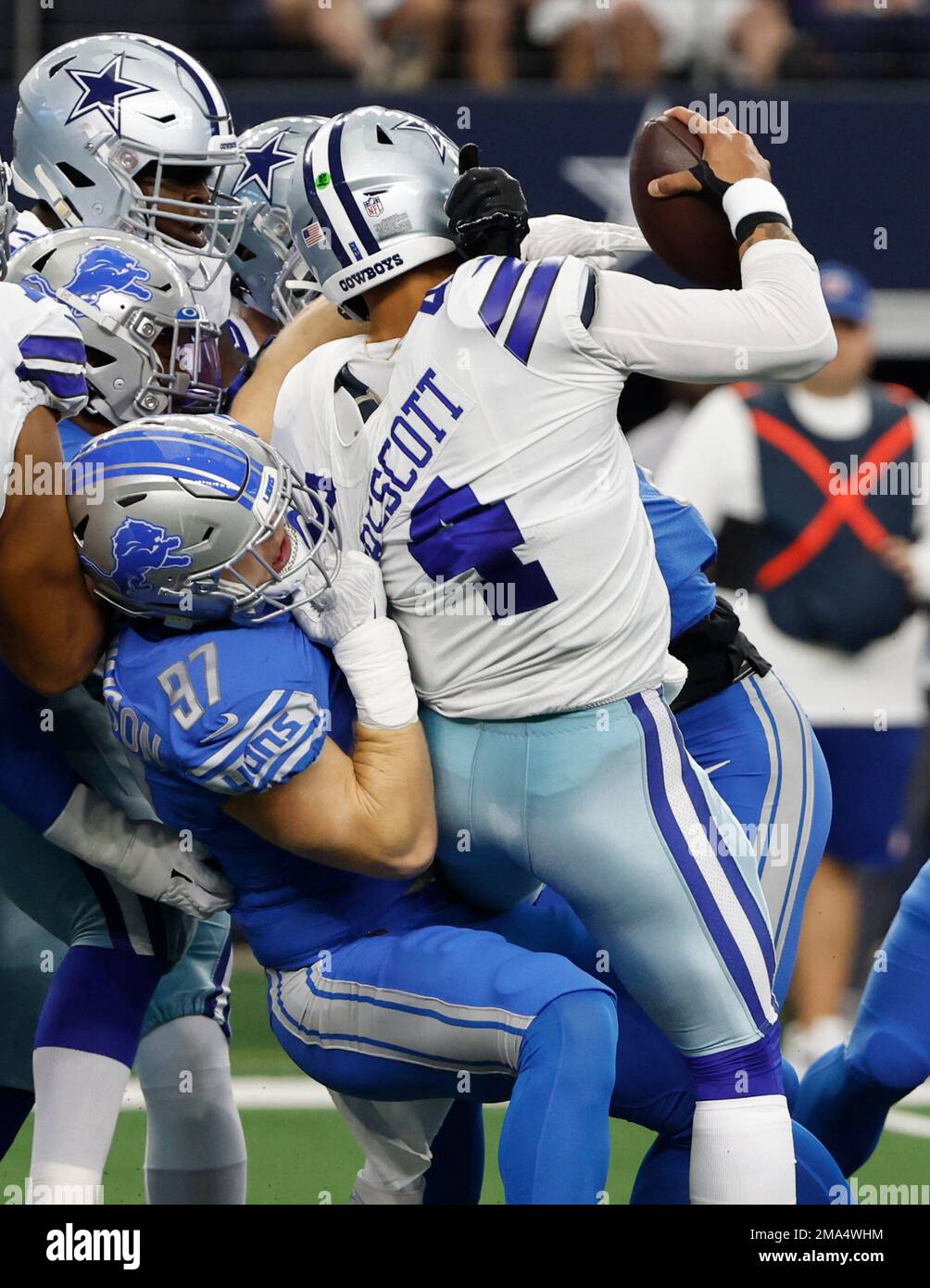 Dallas Cowboys quarterback Dak Prescott (4) is sacked by Detroit Lions ...