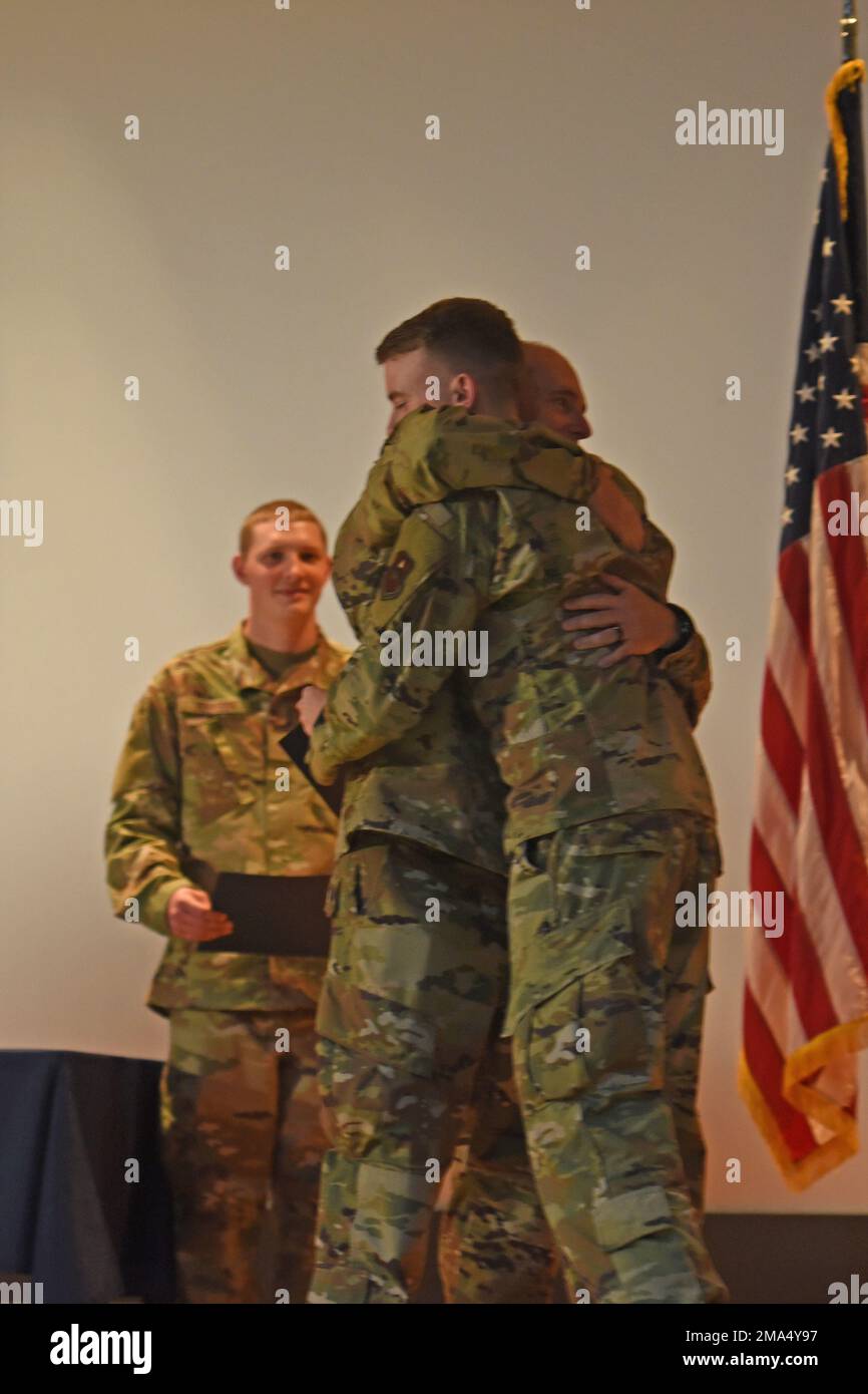 U.S. Air Force Lt. Gen. Kirk S. Pierce, commander of Continental U.S. North American Aerospace Defense Command Region and 1st Air Force (Air Forces Northern and Air Forces Space) (left), hugs his son 1st Lt. Kirk D. Pierce, 315th Training Squadron student (right), during the 315th TRS’s intelligence, surveillance, and reconnaissance professionals’ graduation ceremony, at Goodfellow Air Force Base, Texas, May 24, 2022. The 17th Training Wing has graduated more than 800,000 ISR professionals, who perform and manage intelligence functions and activities to support the United States and allied for Stock Photo