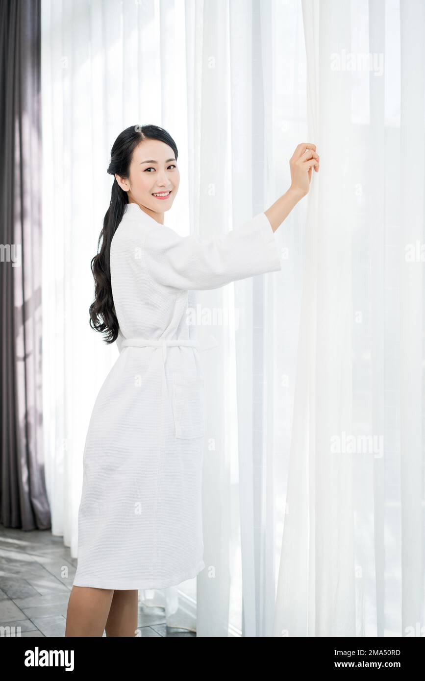 A young woman wearing a bathrobe Stock Photo Alamy