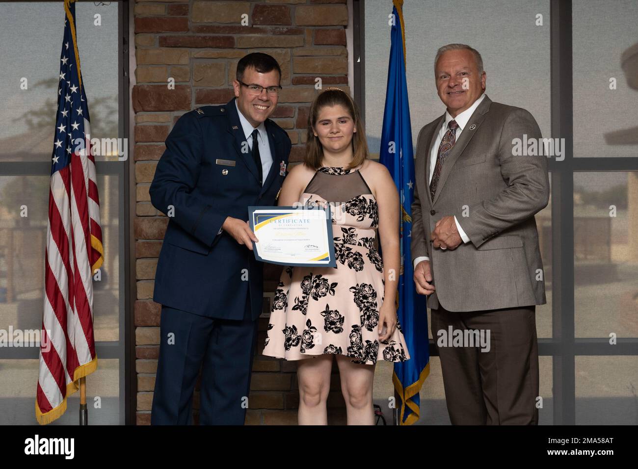 Destiny Mote, Project SEARCH intern, receives graduation certificate, May 24, 2022, on Holloman Air Force Base, New Mexico. Project SEARCH is a year-long internship to help intellectually disabled high school graduates develop job skills. Stock Photo