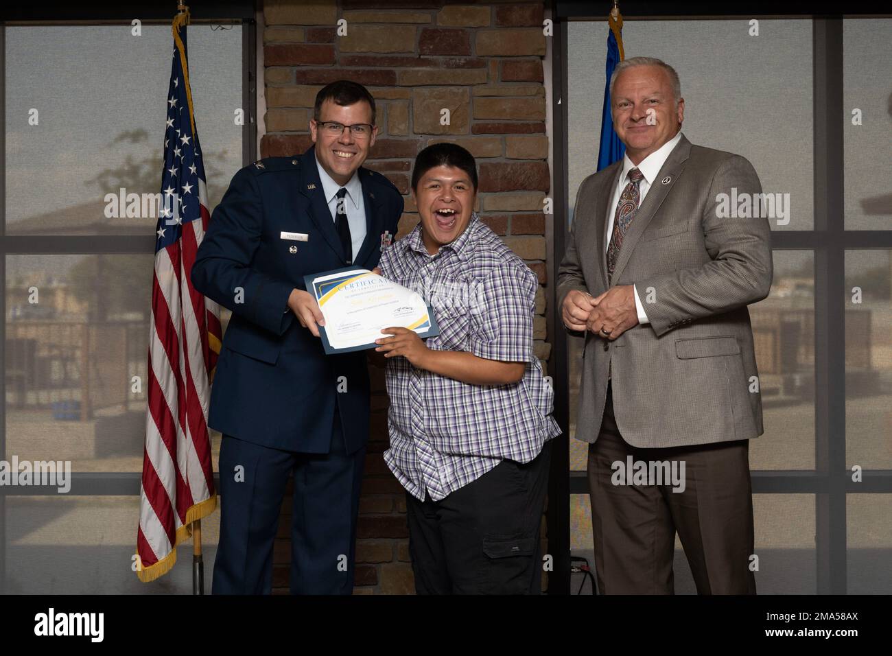 Seth Kernohan, Project SEARCH intern, receives graduation certificate, May 24, 2022, on Holloman Air Force Base, New Mexico. Project SEARCH is a year-long internship to help intellectually disabled high school graduates develop job skills. Stock Photo