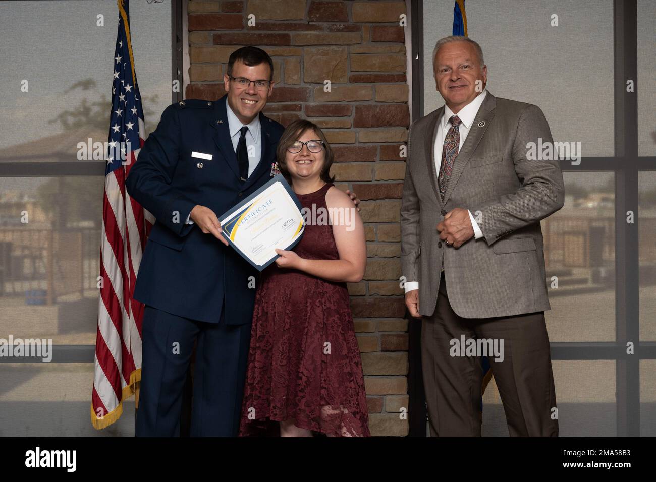 Alyssa Bailey, Project SEARCH intern, receives graduation certificate, May 24, 2022, on Holloman Air Force Base, New Mexico. Project SEARCH is a year-long internship to help intellectually disabled high school graduates develop job skills. Stock Photo