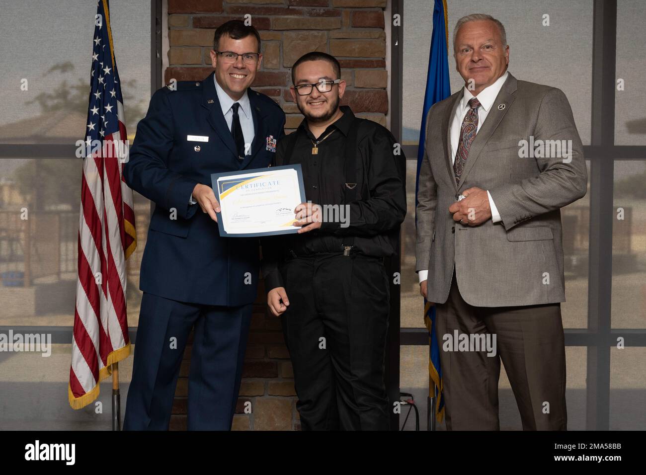 Adrian Alonson-Roman, Project SEARCH intern, receives graduation certificate, May 24, 2022, on Holloman Air Force Base, New Mexico. Project SEARCH is a year-long internship to help intellectually disabled high school graduates develop job skills. Stock Photo