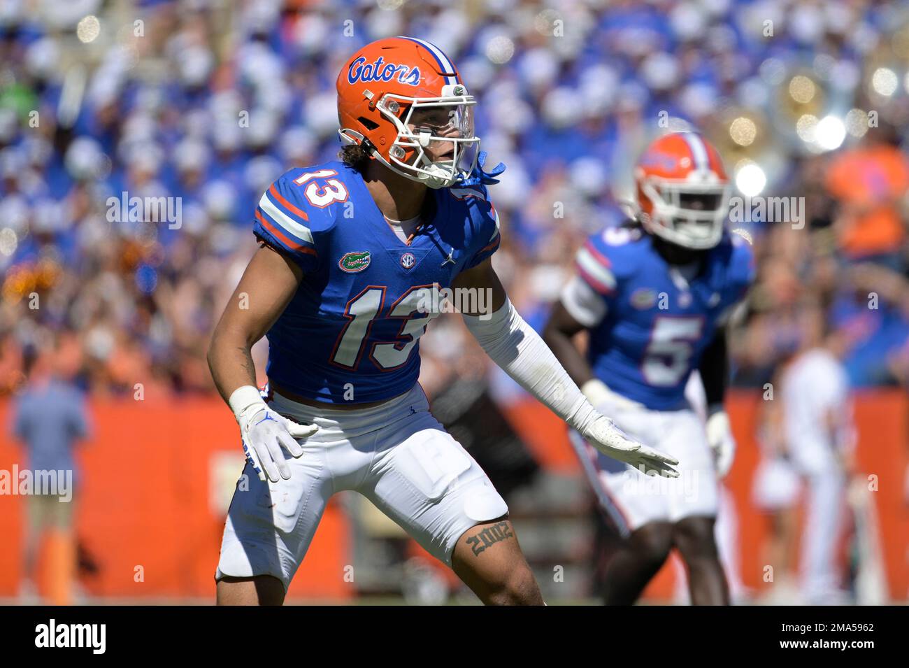 Florida safety Donovan McMillon (13) defends against Eastern Washington  wide receiver Efton Chism III (89) during the second half of an NCAA  college football game, Sunday, Oct. 2, 2022, in Gainesville, Fla. (