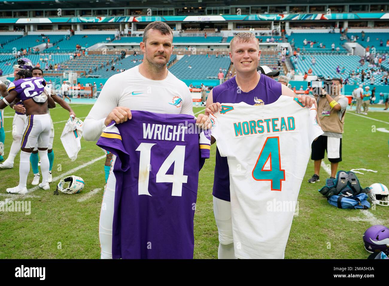 Miami Dolphins punter Thomas Morstead, left and Minnesota Vikings punter  Ryan Wright, right, trade jerseys after an NFL football game, Sunday, Oct.  16, 2022, in Miami Gardens, Fla. (AP Photo/Wilfredo Lee Stock