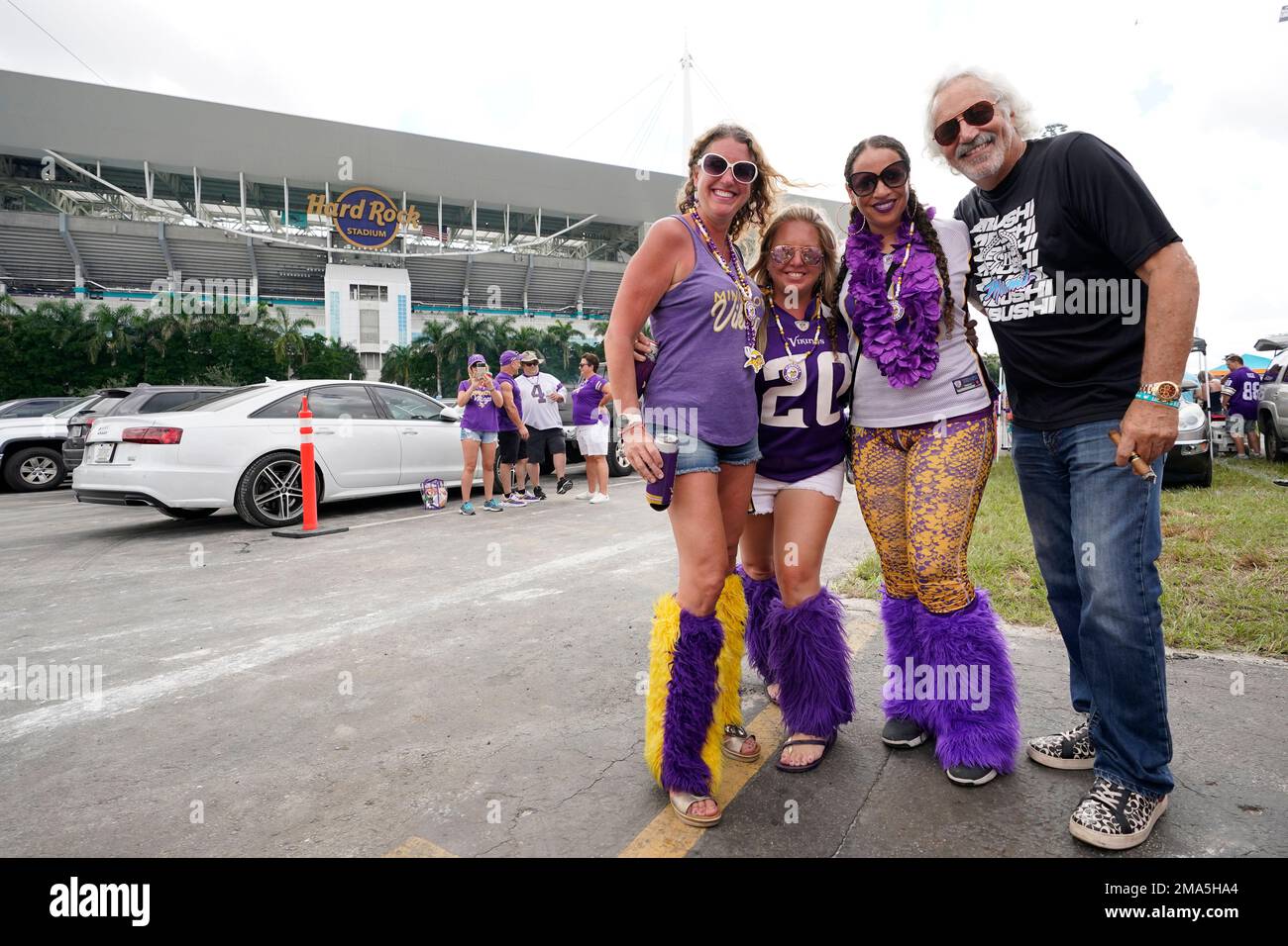 Minnesota Vikings fans pose for a photo in the parking lot as they tailgate  before the start of an NFL football game between the Miami Dolphins and the  Vikings, Sunday, Oct. 16,