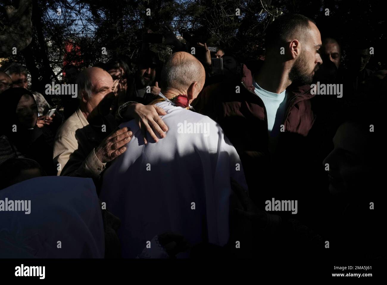 Maher Younis, center, a Palestinian citizen of Israel who served a lengthy  jail sentence for killing a soldier, is embraced after his release amid  promises by the country's ultranationalist National Security Minister