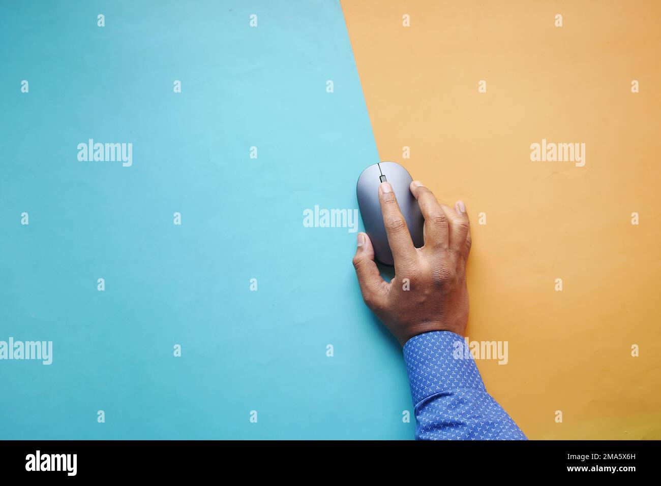 Businessman hand with computer mouse, Close up Stock Photo