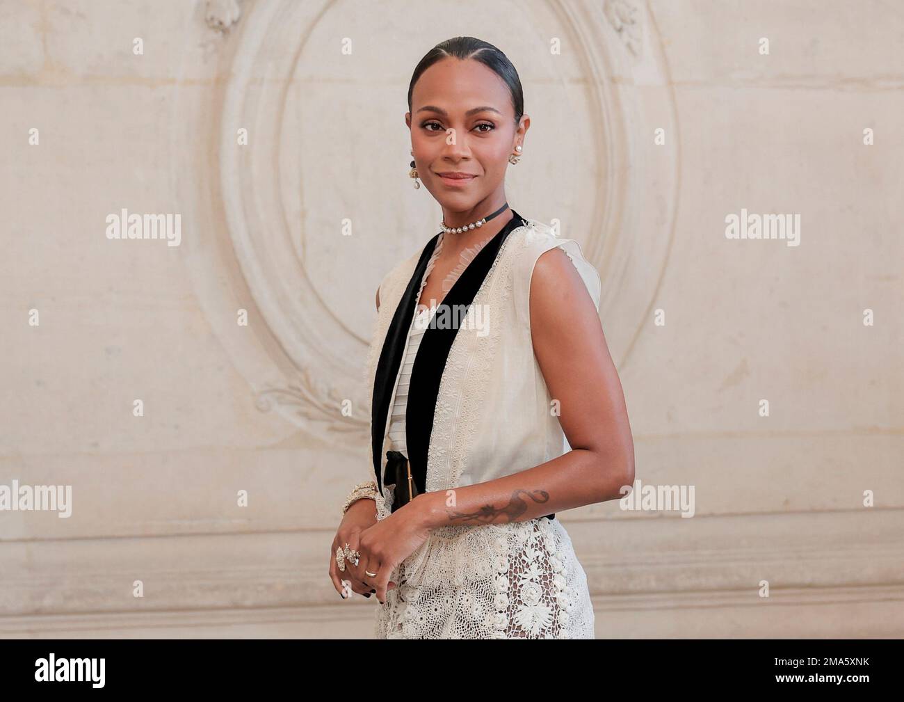 FILE - Zoe Saldana appears at the Dior Haute Couture Fall/Winter 2022-2023  fashion collection in Paris on July 4, 2022. Saldana stars in the Netflix  series "From Scratch." (AP Photo/Lewis Joly, File