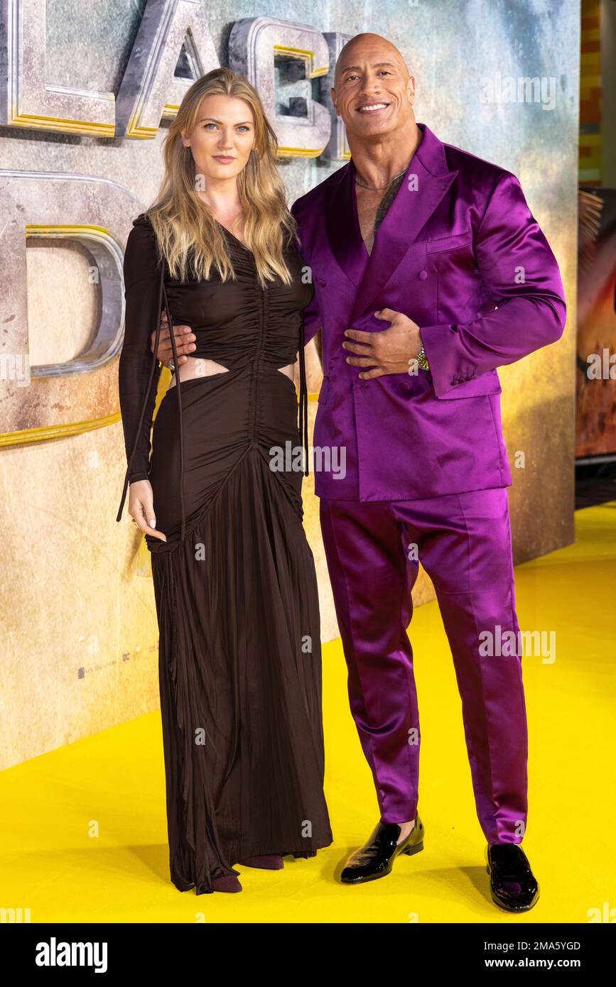 Ella Craig, left, and Dwayne Johnson a.k.a. The Rock pose for photographers upon arrival for the premiere of the film Black Adam on Tuesday, Oct