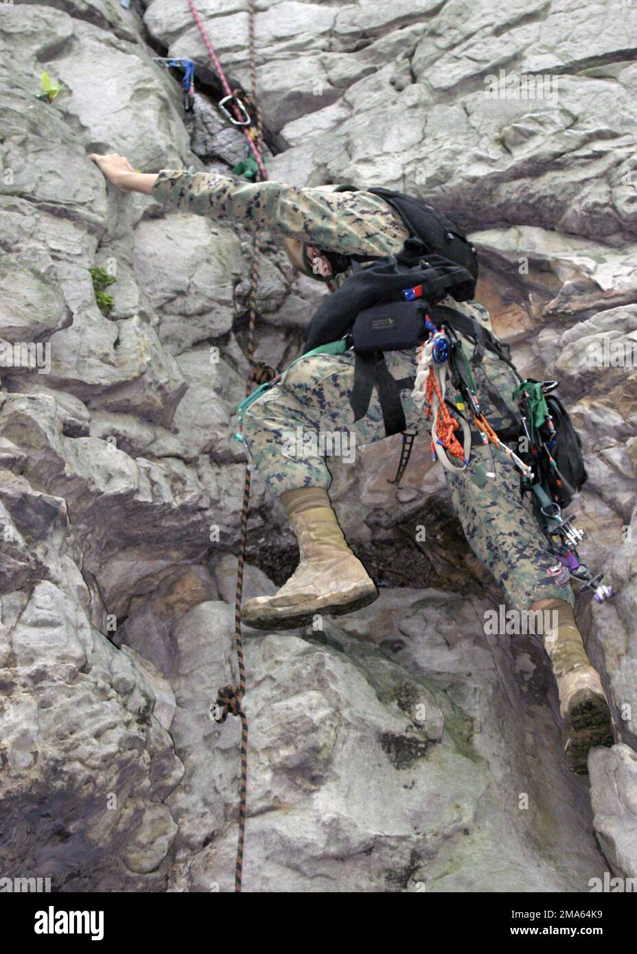 A US Marine Corps (USMC) Marine from 1ST Battalion, 2nd Marines climbs a rock wall during the Assault Climbers Course in Camp Dawson, West Virginia (WV). Marines from Battalion Landing Team (BLT) 1/2 are participating in the 6-week course. BLT 1/2 is the ground combat element of the 22nd Marine Expeditionary Unit (MEU). Base: Camp Dawson State: West Virginia (WV) Country: United States Of America (USA) Stock Photo