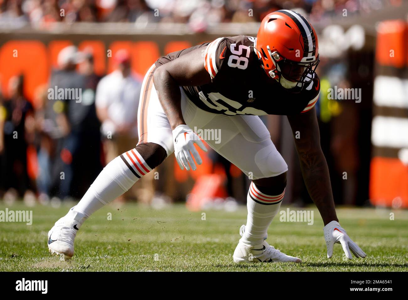 Cleveland Browns defensive end Isaiah Thomas (58) lines up for a play  during an NFL football game against the New England Patriots, Sunday, Oct.  16, 2022, in Cleveland. (AP Photo/Kirk Irwin Stock