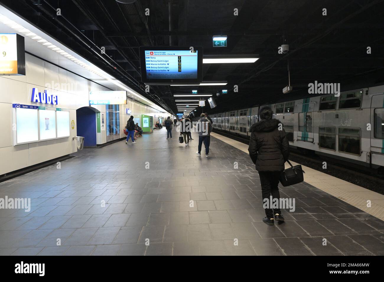 Commuters walk in a Reseau Express Regional (RER) metro station in