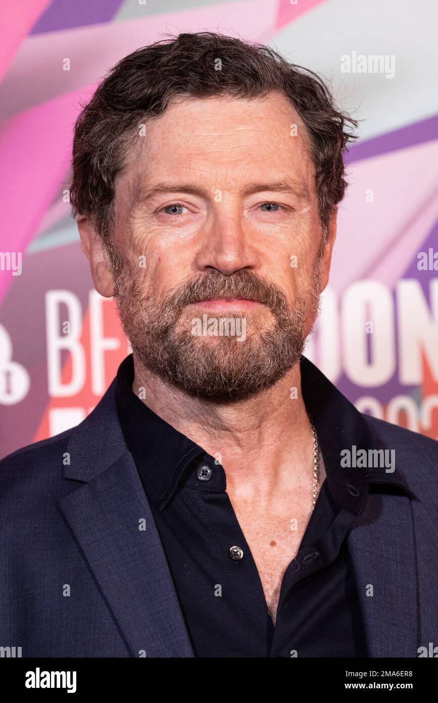 Steve Wall poses for photographers upon arrival for the premiere of the