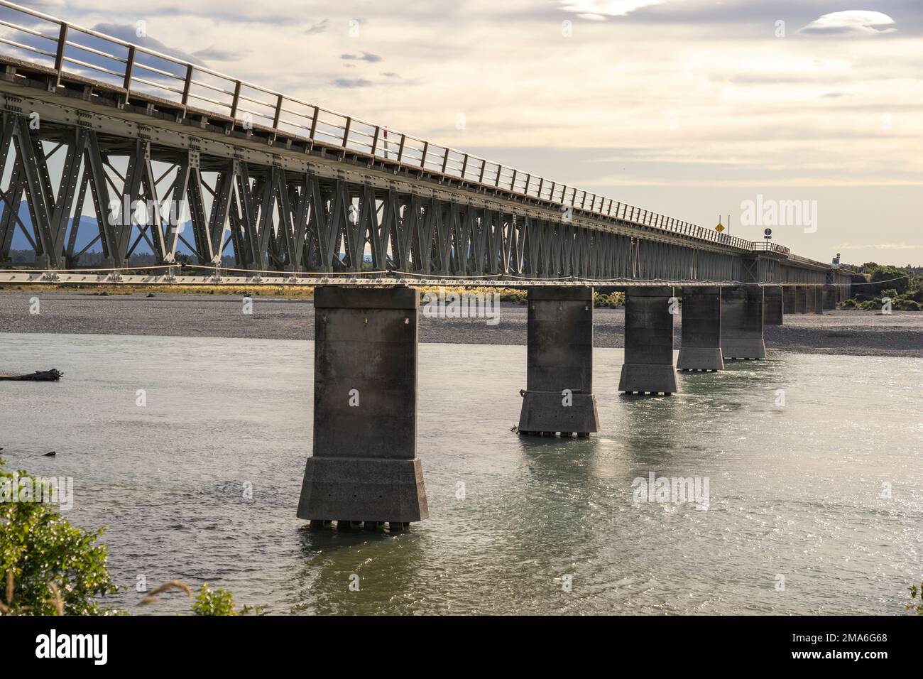 The Haast River Bridge is the longest one-lane road bridge in New Zealand Stock Photo