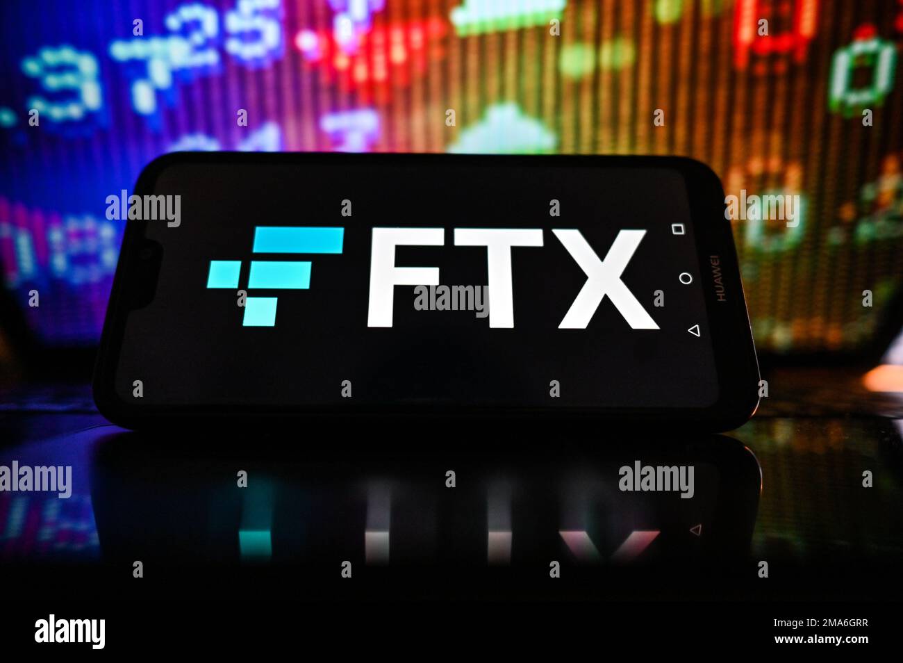 Poland. 19th Jan, 2023. In this photo illustration a FTX logo is displayed on a smartphone with stock market percentages on the background. Credit: SOPA Images Limited/Alamy Live News Stock Photo