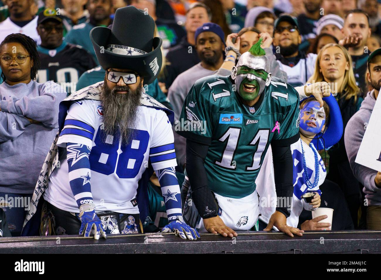 Dallas Cowboys fan looks on with a Philadelphia Eagles fan looks on