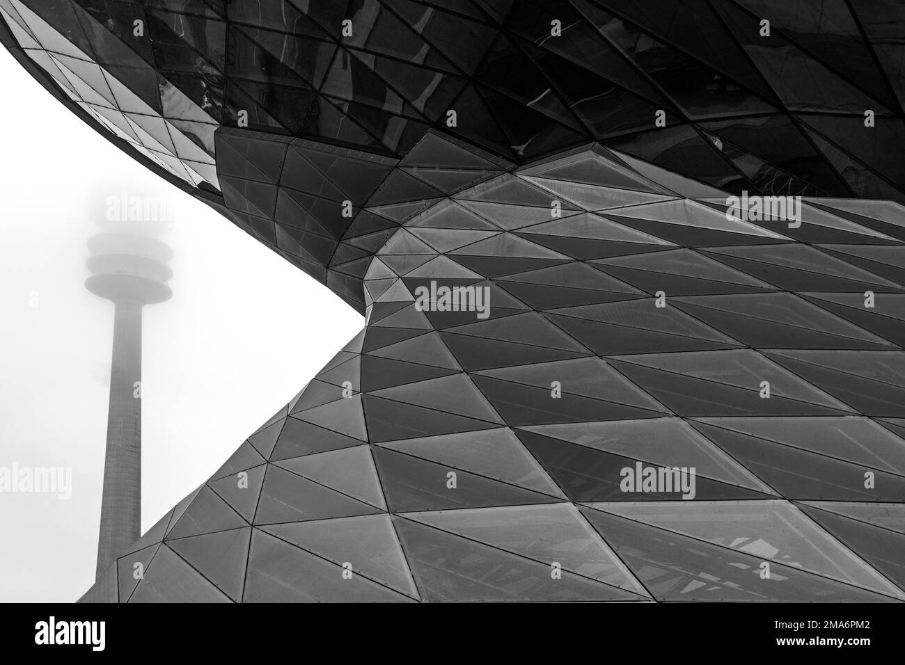Detail of the facade of BMW Welt, Olympic Tower at the back, Munich, Bavaria, Germany Stock Photo