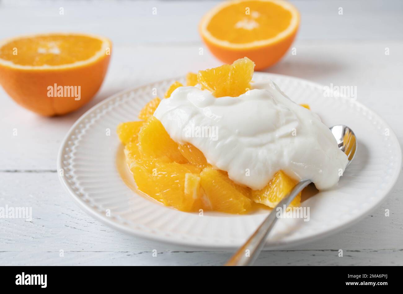 Protein dessert with fresh chopped oranges and greek yogurt isolated on