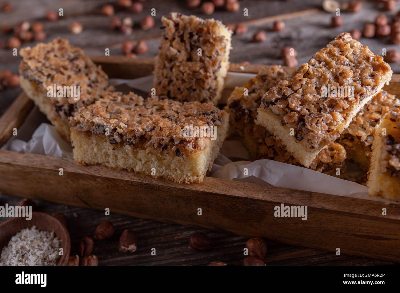 Cake with nuts on wooden table Stock Photo
