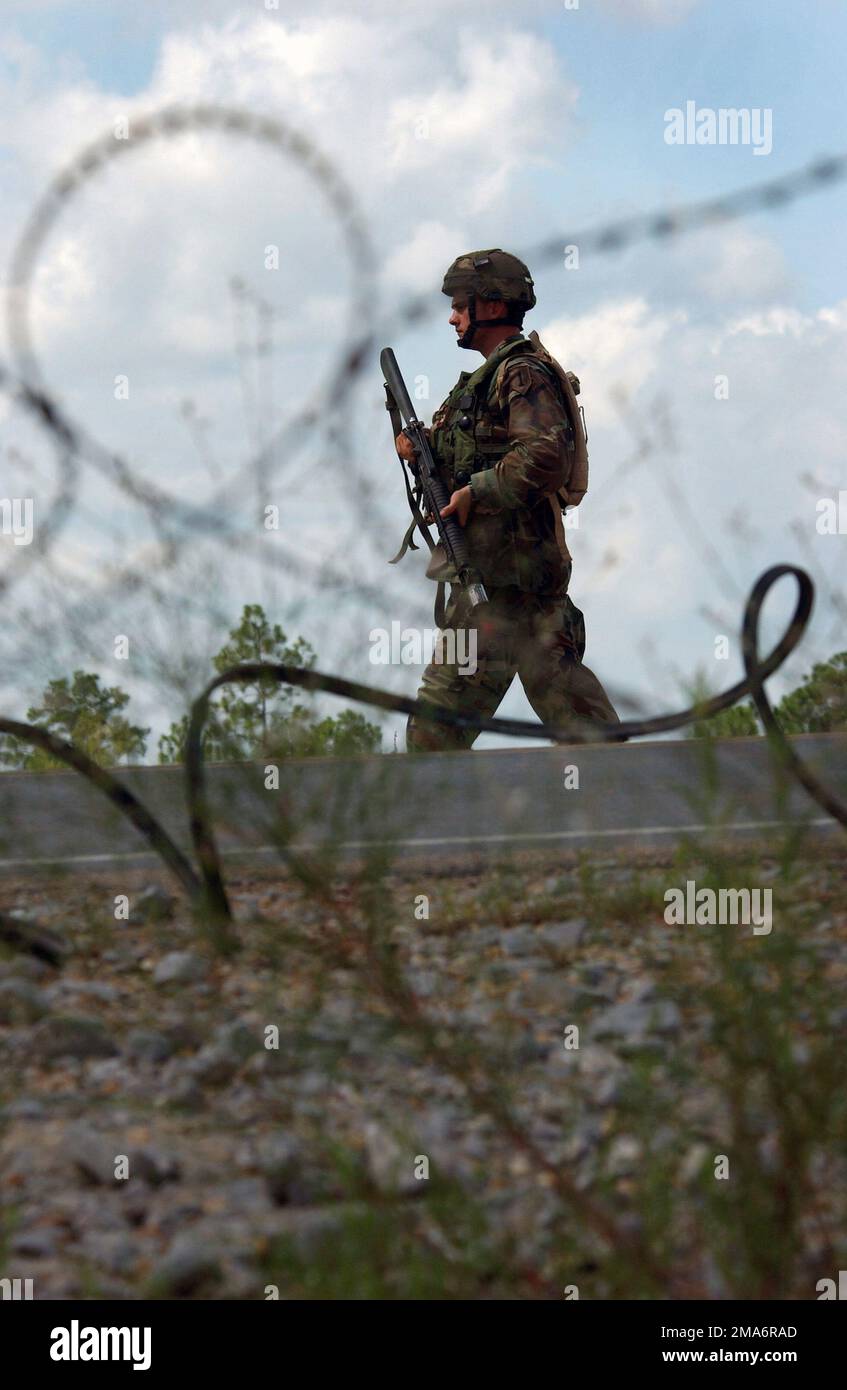 050820-F-6988D-071. [Complete] Scene Caption: A US Army (USA) Soldier, with a 5.56 mm M16A2 rifle, maintains security at the Joint Readiness Training Center (JRTC), Fort Polk, Louisiana (LA), during an Aeromedical Evacuation training exercise. Aeromedical Evacuation training is conducted at the JRTC so that joint forces can participate under realistically accurate scenarios and conditions replicating the initial phases of a contingency, to include: deployment from home stations; staging at an intermediate base area; onward deployment by air, land, and ground convoy and initial combat employmen Stock Photo