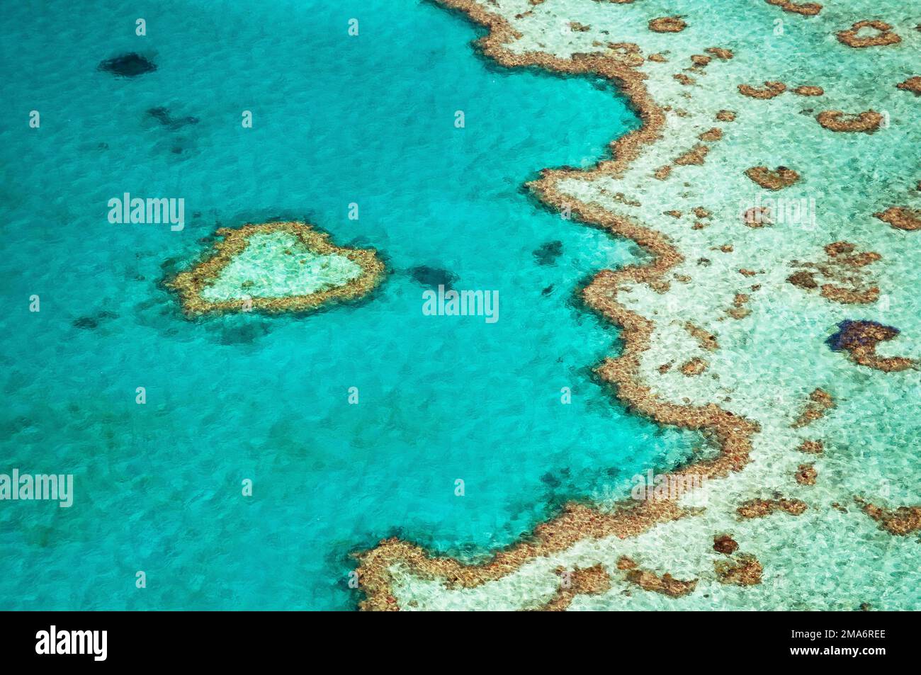 Aerial view, reefs and atolls of the Great Barrier Reef, Heart Reef ...