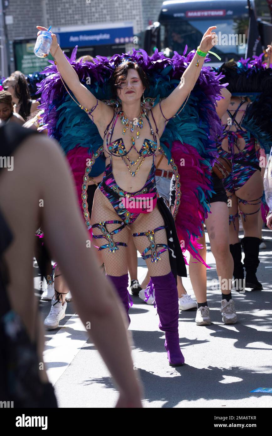 Scantily clad woman with colourful wings walk in the CSD parade