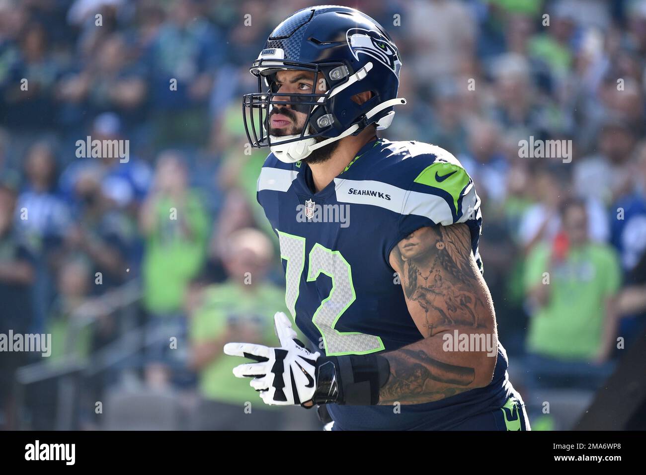 Seattle Seahawks offensive tackle Abraham Lucas (72) gets set