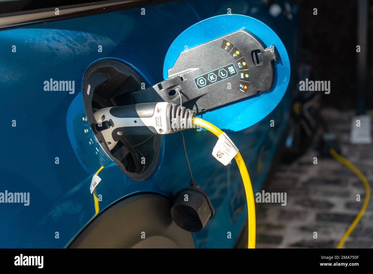 Charger of an electric car charging the batteries in the garage of the house, not gasoline Stock Photo