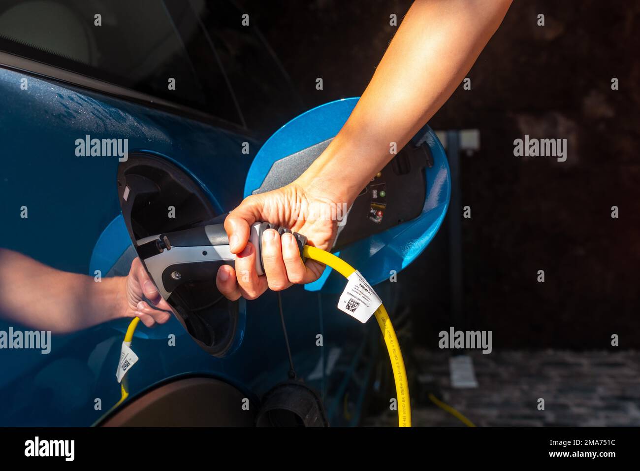 Charging an electric car charging the batteries in the garage at home