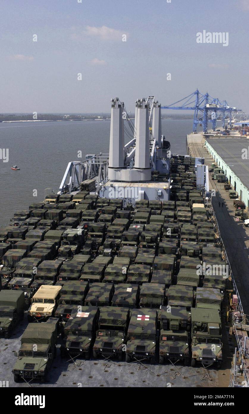 A fleet of US Army (USA) High-Mobility Multipurpose Wheeled Vehicles (HMMWV) from the 82nd Airborne Division (AD), Fort Bragg, North Carolina (NC), loaded onto the Bob Hope Class Military Sealift Command (MSC) Large, Medium-Speed Roll-on/Roll-Off Ship USNS PILILAAU (T-AKR 304) docked at New Orleans. The US Navy and Armys involvement in the Hurricane Rita humanitarian assistance operations are led by the Federal Emergency Management Agency (FEMA), in conjunction with the Department of Defense (DoD). (Duplicate image, see also DFSD0602390 or search 050928F1424R025). Base: New Orleans State: Loui Stock Photo