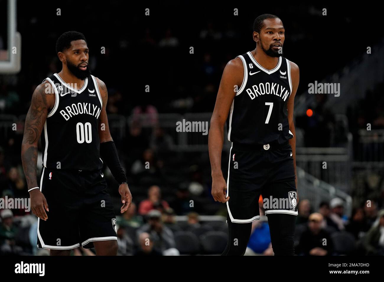 Brooklyn Nets Kevin Durant and Royce ONeale watch a free throw during the first half of an NBA preseason basketball game against the Milwaukee Bucks Wednesday, Oct