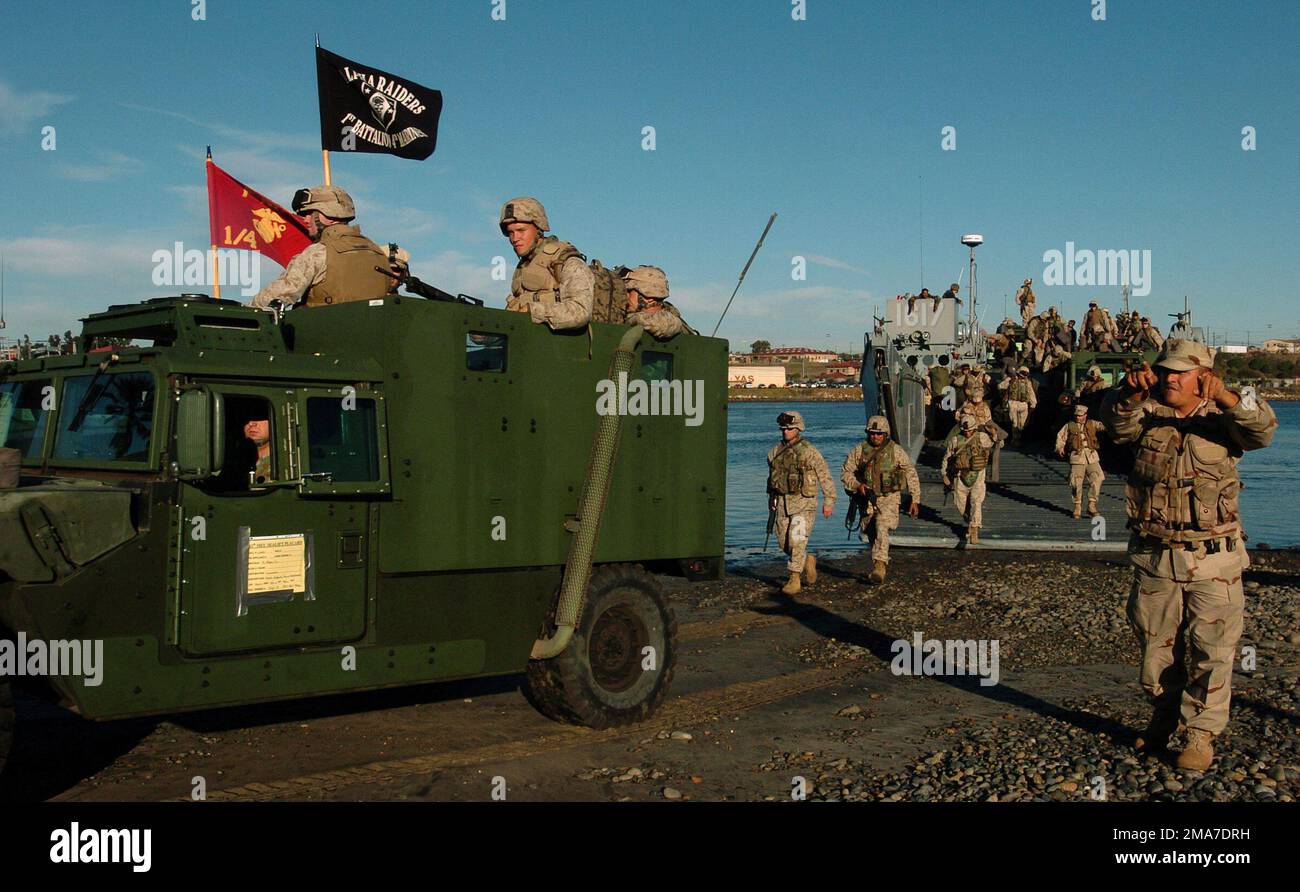US Marine Corps (USMC) Marines assigned to the 11th Marine Expeditionary Unit (MEU) drive out of US Navy (USN) Landing Craft Utility 1617 (LCU 1617), Amphibious Craft Unit One (ACU-1), Naval Amphibious Base (NAB) Coronado, California (CA), at the landing area of Del Mar Boat Base, Camp Pendleton, CA. The Navy and Marines units are under way off the coast of Southern California for their Composite Unit Training Exercise (COMPTUEX) for a regularly scheduled deployment. Base: Del Mar Boat Base State: California (CA) Country: United States Of America (USA) Stock Photo