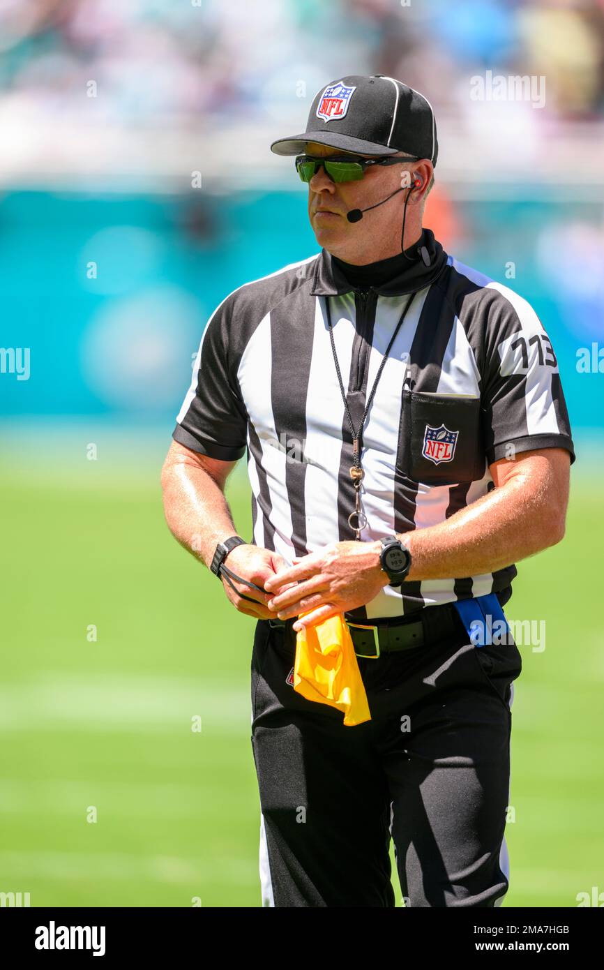 NFL down judge Danny Short holds his penalty flag during an NFL