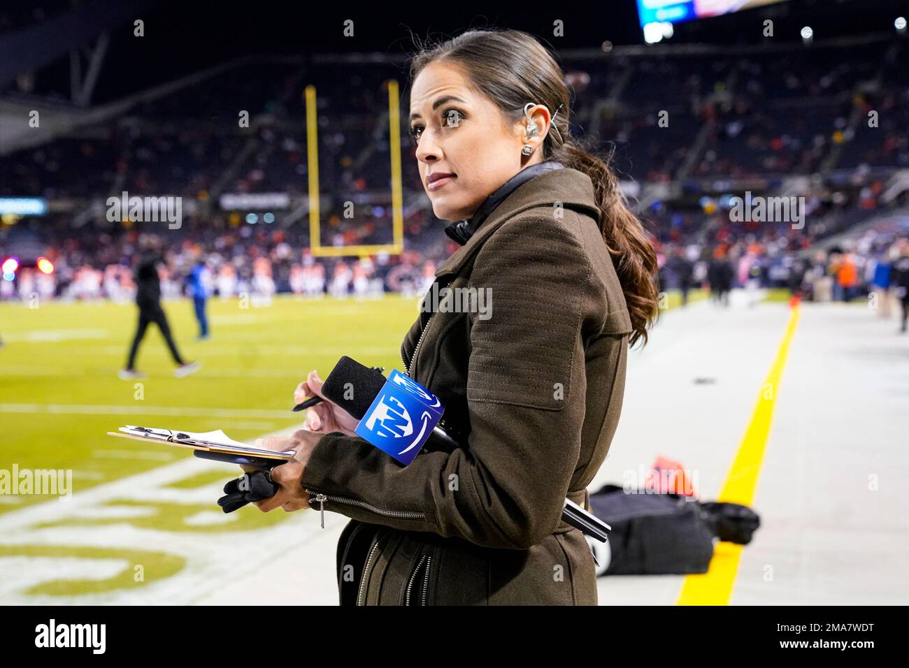 Kaylee Hartung, sideline reporter for Thursday Night Football, on the field  before an NFL football game between the Washington Commanders and the  Chicago Bears in Chicago, Thursday, Oct. 13, 2022. (AP Photo/Charles