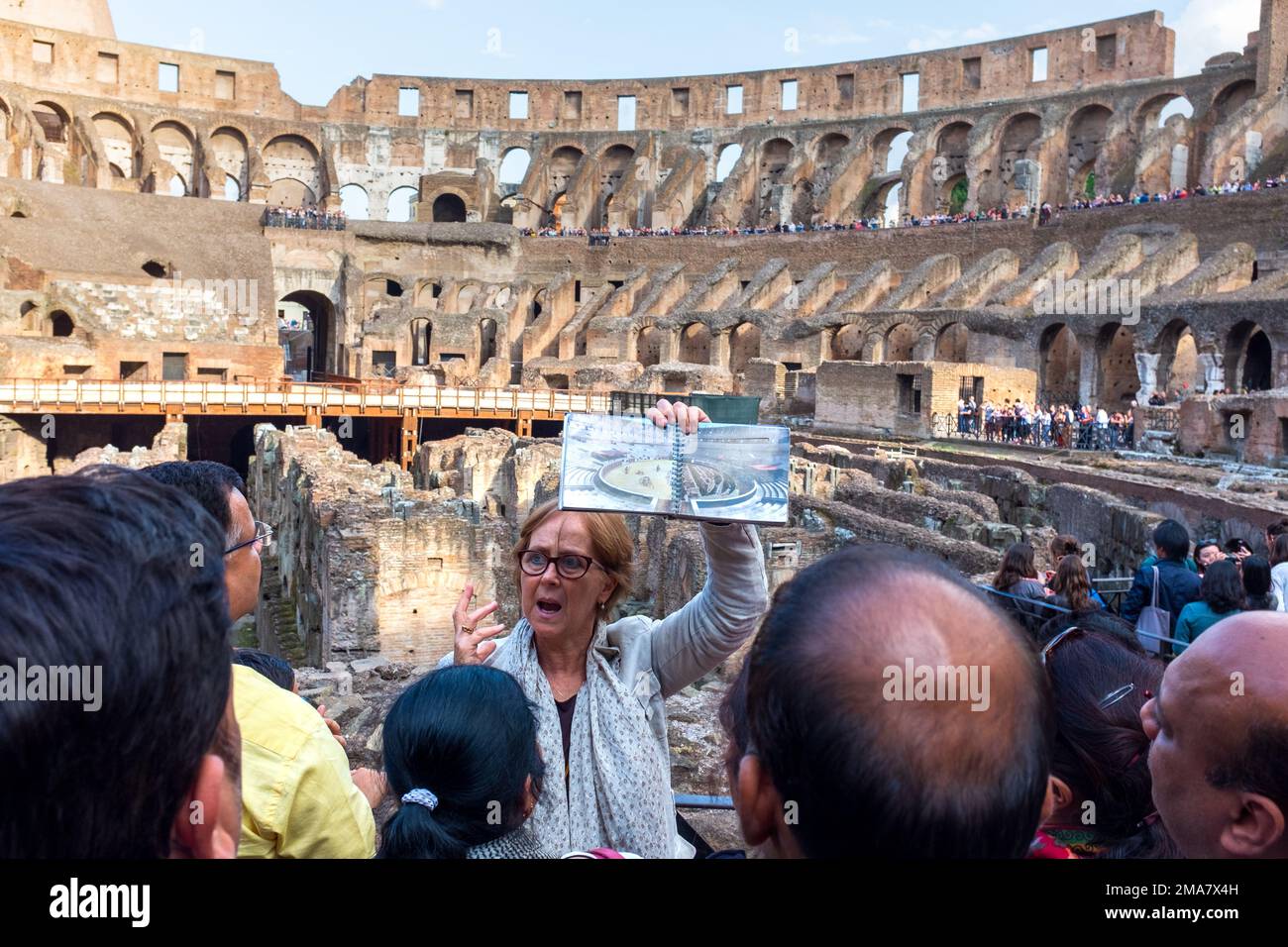 People in the Colosseum ancient amphitheatre and arena in Rome the Italian capital Stock Photo