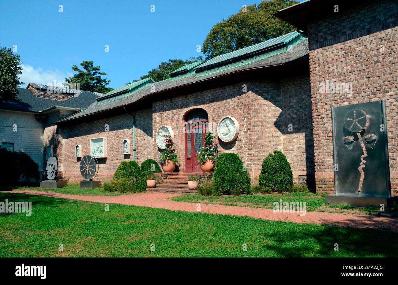 The exterior and West Lawn of the Southampton Arts Center, with ...