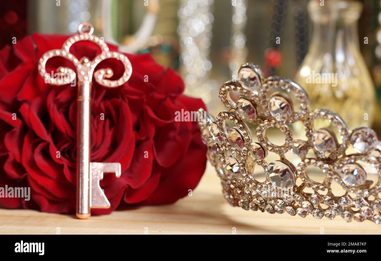 Red Rose with Key and Tiara on Dressing Table Stock Photo - Alamy