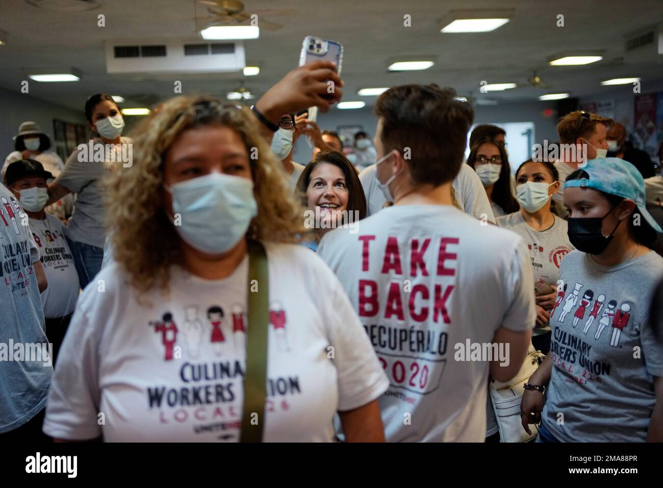 Sen. Catherine Cortez Masto, D-Nev., center, poses for selfies with ...