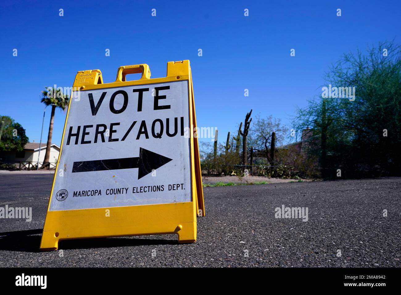 A sign marks the entrance to a voting precinct on the first day of