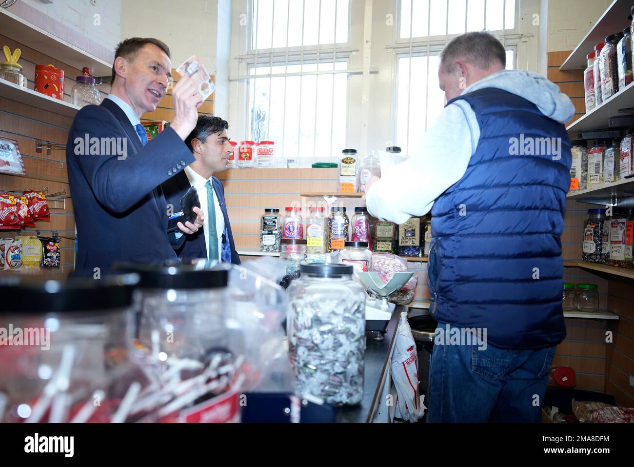 Chancellor Jeremy Hunt (left) and Prime Minister Rishi Sunak (centre ...