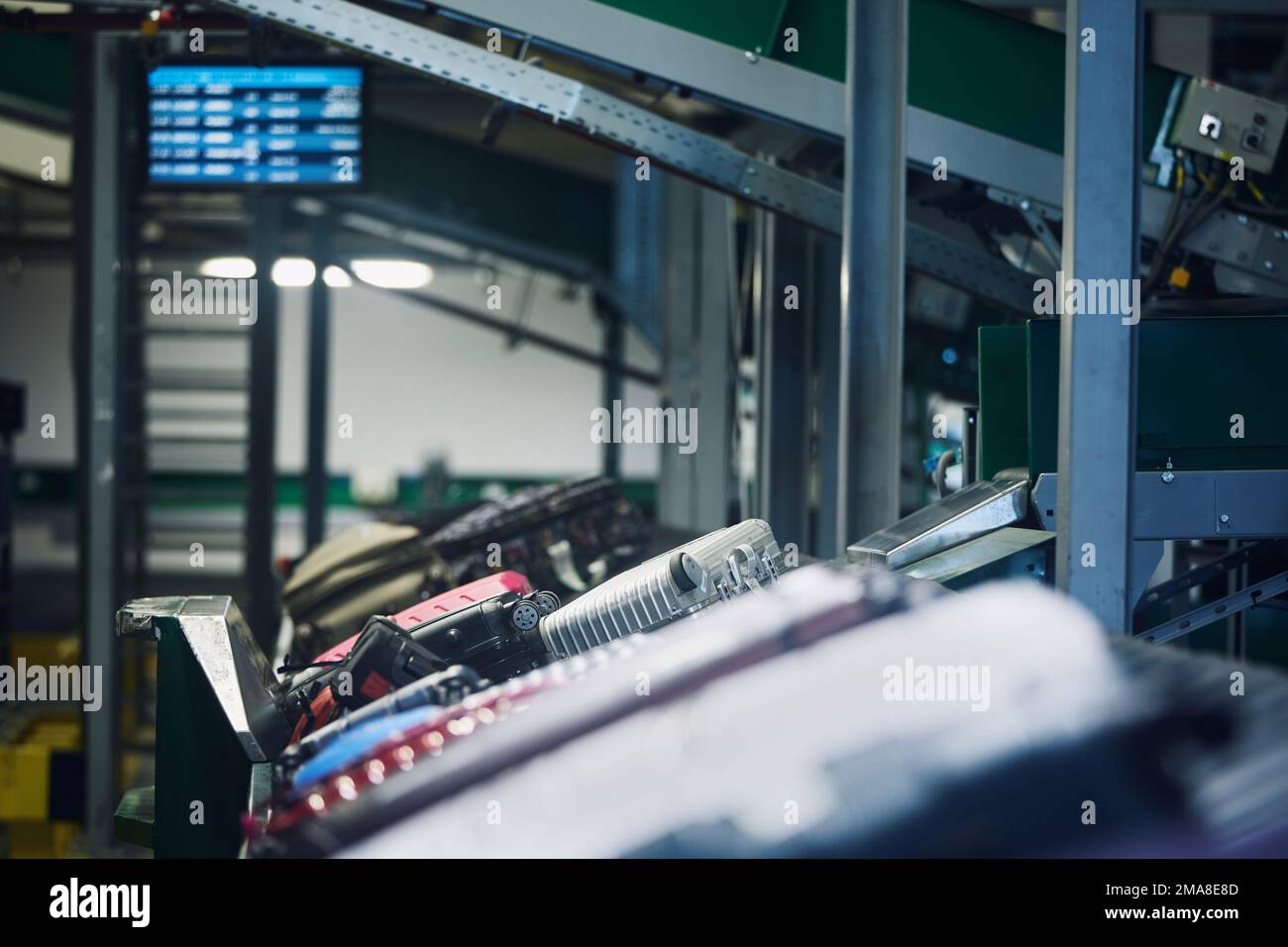 Lot of luggage on conveyor belt. Baggage sorting at airport. Traveling by airplane. Stock Photo
