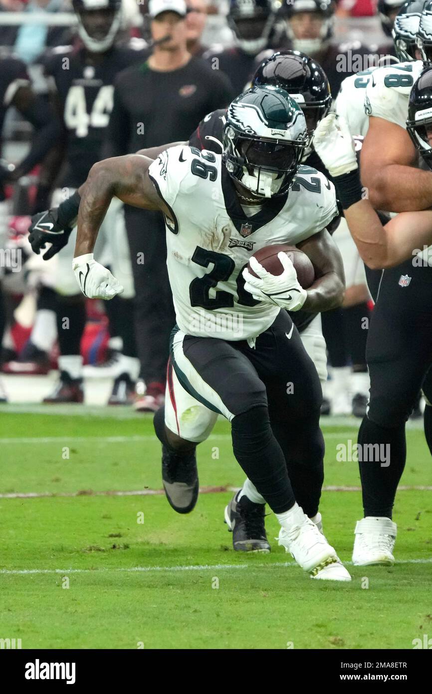 Chicago, United States. 18th Dec, 2022. Philadelphia Eagles quarterback  Jalen Hurts (1) hands off the ball to Philadelphia Eagles running back  Miles Sanders (26) during a game against the Chicago Bears at