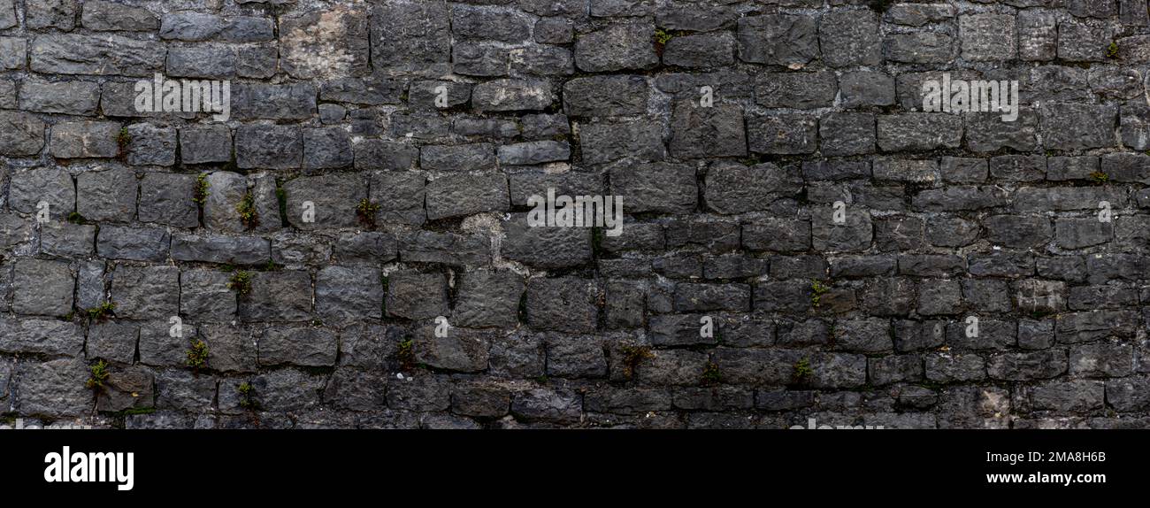 Panoramic natural stone wall pattern for background Stock Photo - Alamy