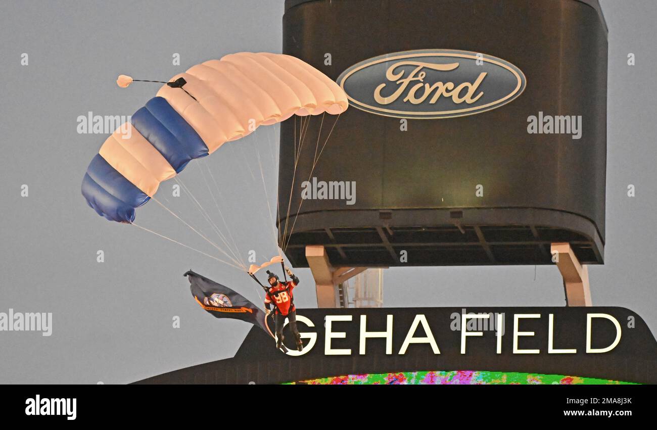A member of the United States Air Force parachute team, parachutes into