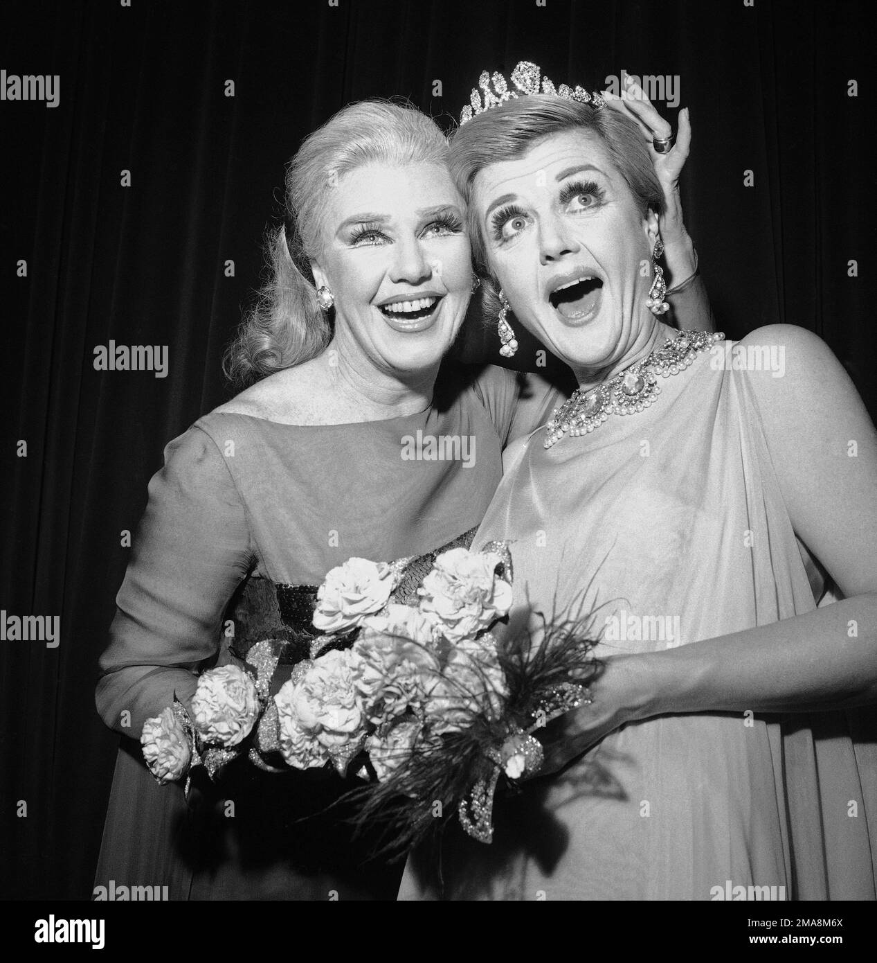 FILE Ginger Rogers, left, star of the Broadway musical "Hello, Dolly" crowns Angela Lansbury