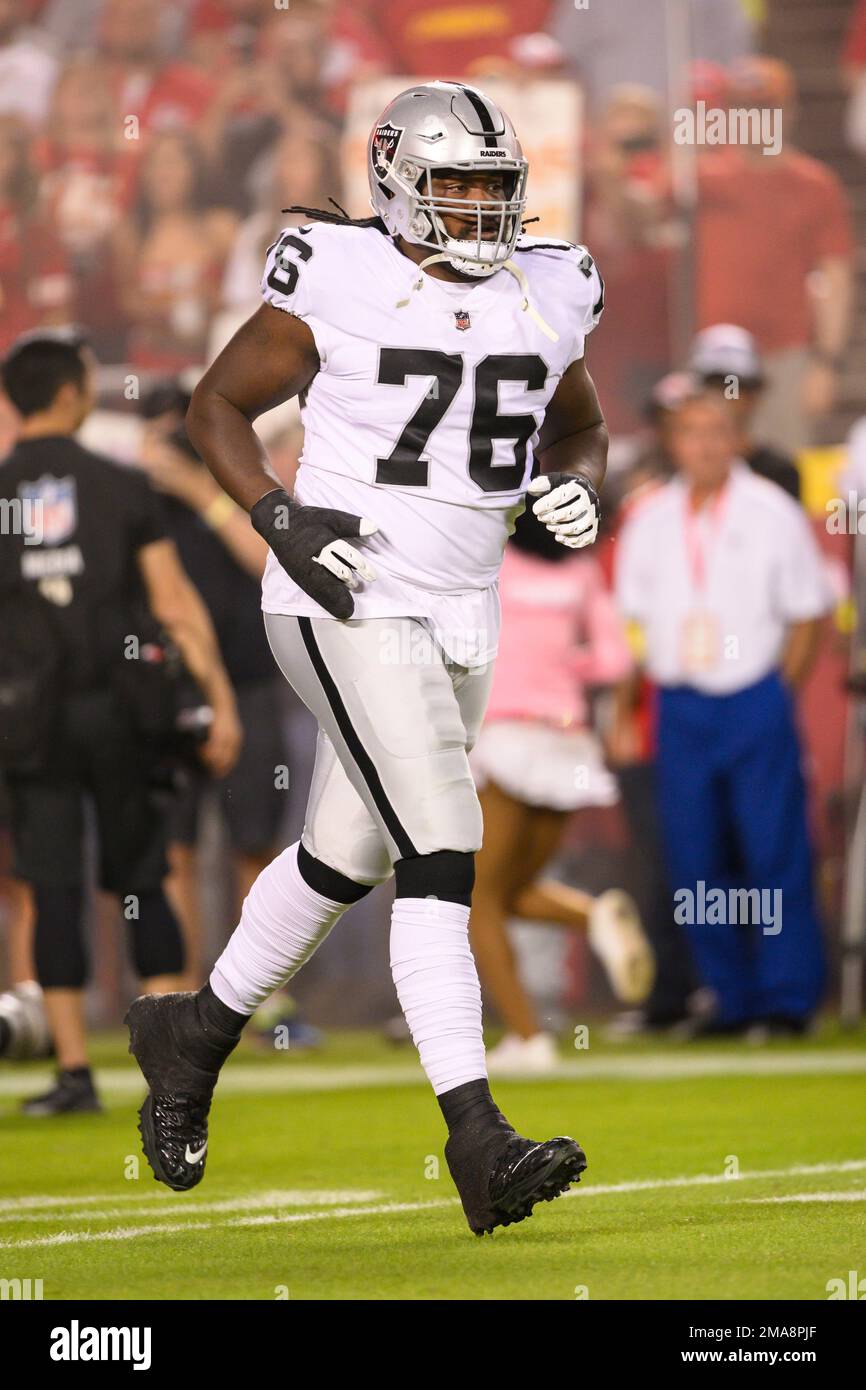 Las Vegas Raiders guard John Simpson comes onto the field during  introductions before the start of an NFL football game against the Kansas  City Chiefs, Monday, Oct. 10, 2022 in Kansas City,