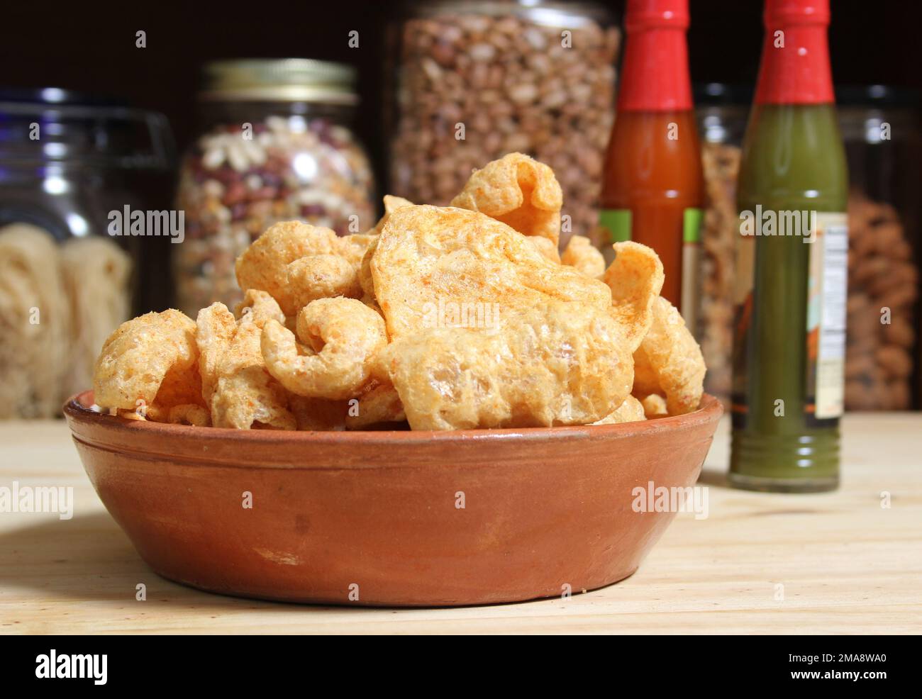 Fried Pork Rinds With Hot Sauce in Rustic Kitchen Stock Photo Alamy