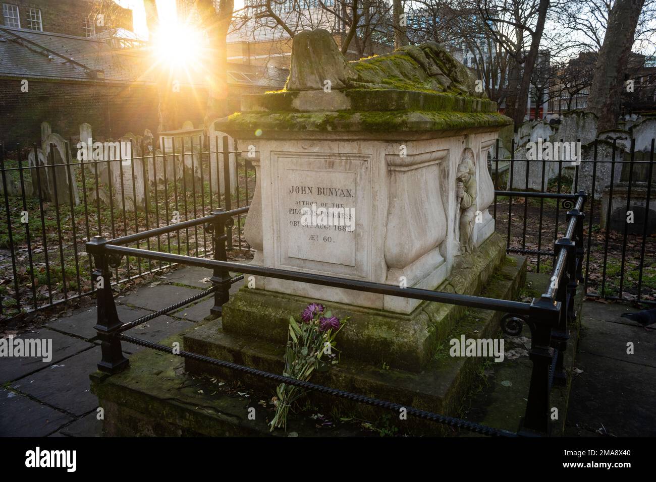 Memorial to John Bunyan, Pilgrim's Progress author, in Bunhill Fields, a former burial ground for nonconformists in Islington, London Stock Photo