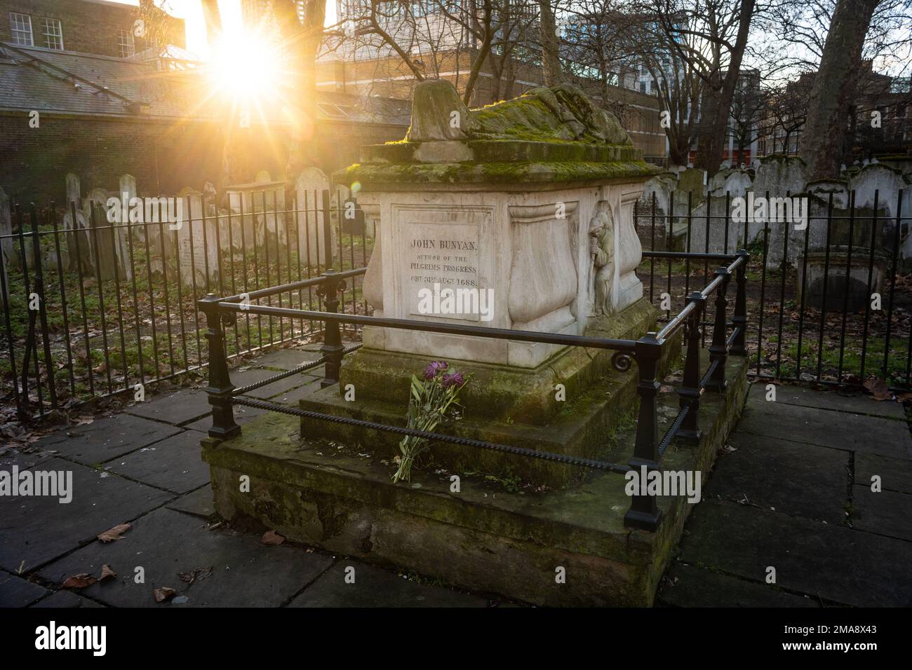 Memorial to John Bunyan, Pilgrim's Progress author, in Bunhill Fields, a former burial ground for nonconformists in Islington, London Stock Photo